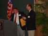 Stan presenting Bill Galvani with a signed Pilot #1 hat 133.JPG